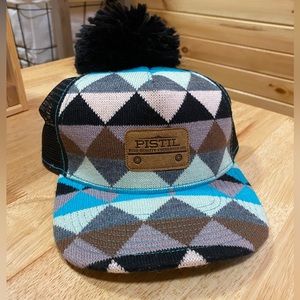 Pistil trucker hat with removable pompom